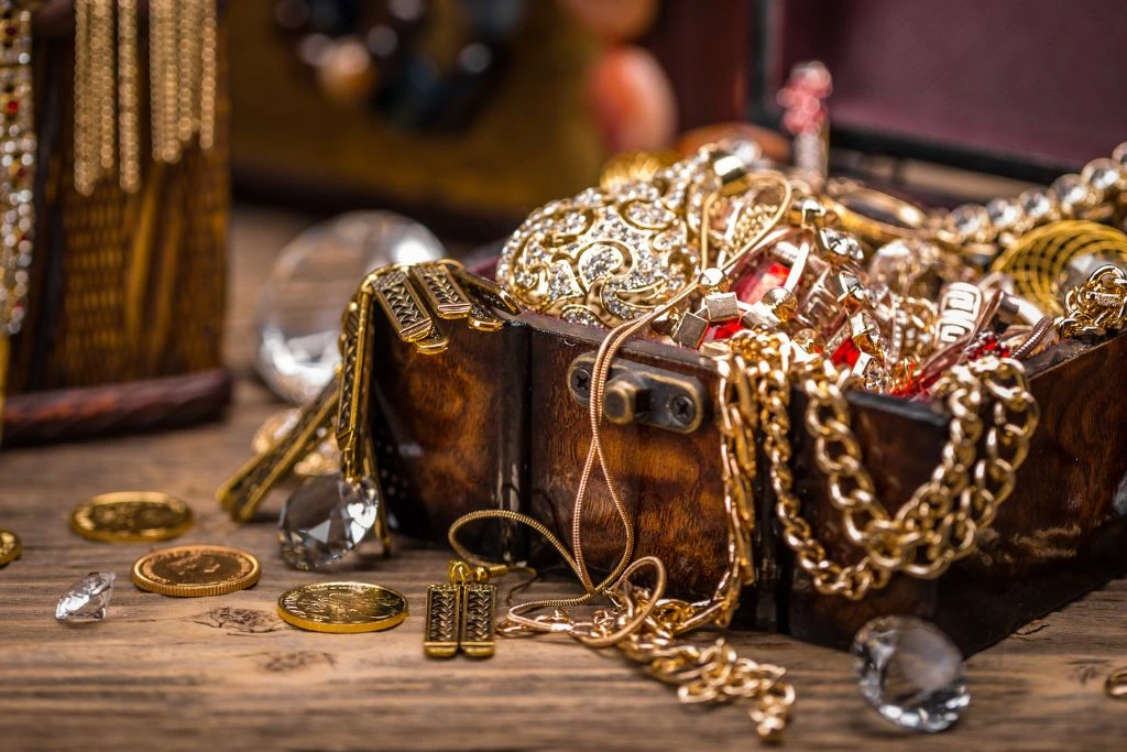 A treasure chest full of jewelry on the table