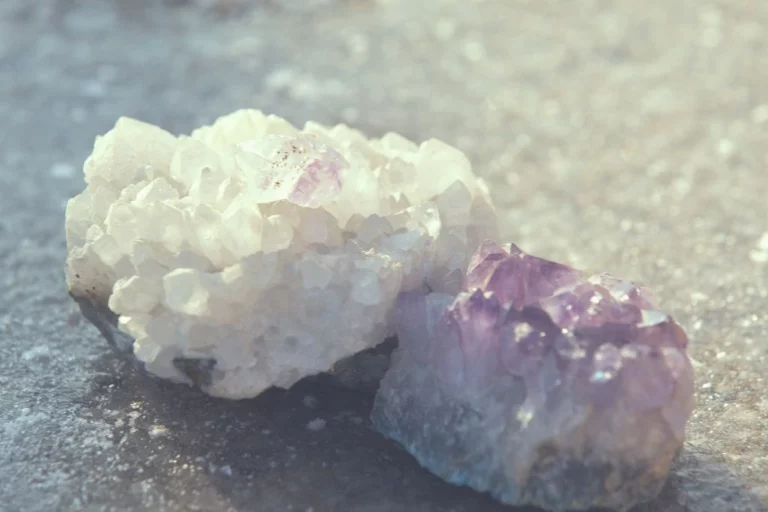 Two crystal cluster crystals on a rock