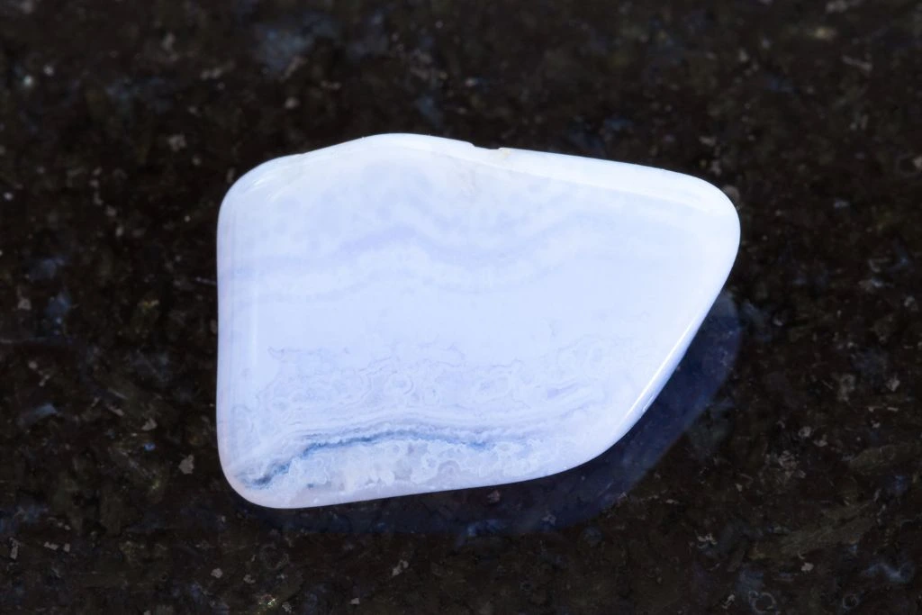 Blue lace agate on a black granite