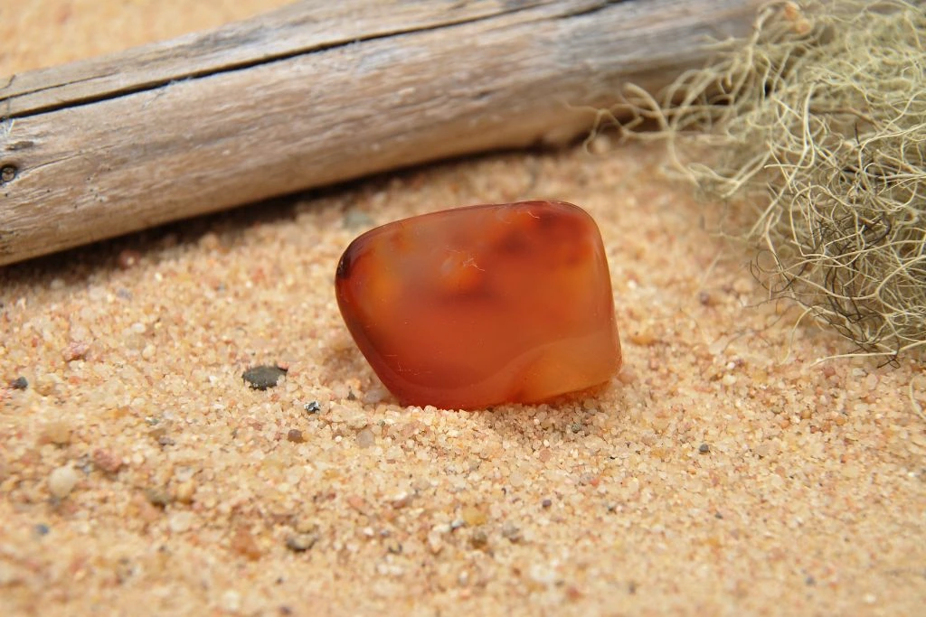 A carnelian crystal on a sand