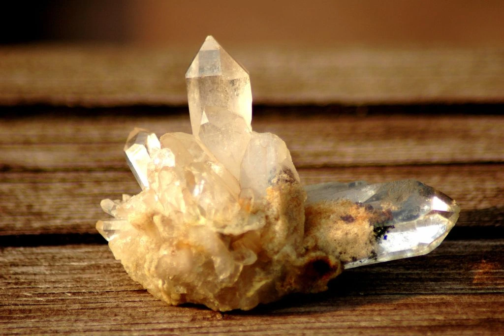 A clear quartz crystal on a table