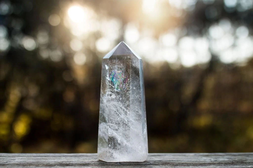 A clear Quartz crystal on a table in nature