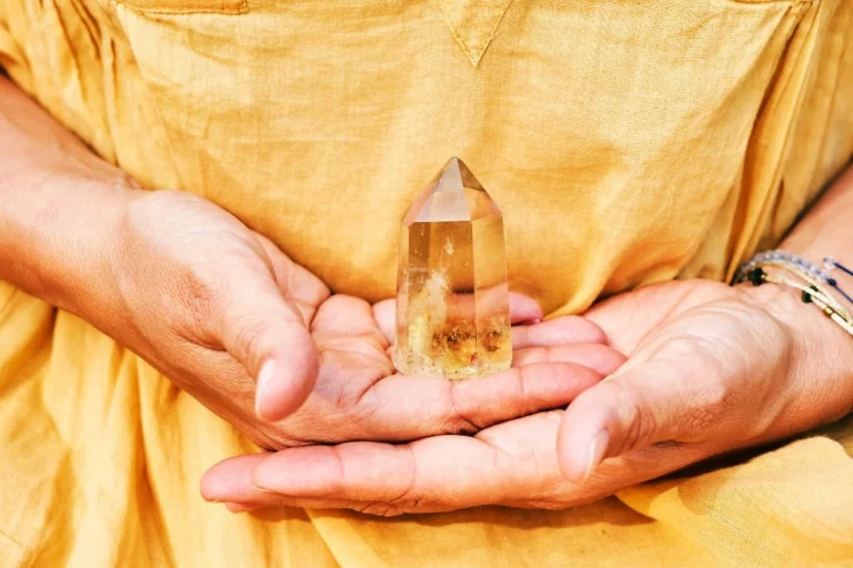 Citrine crystal held by a woman