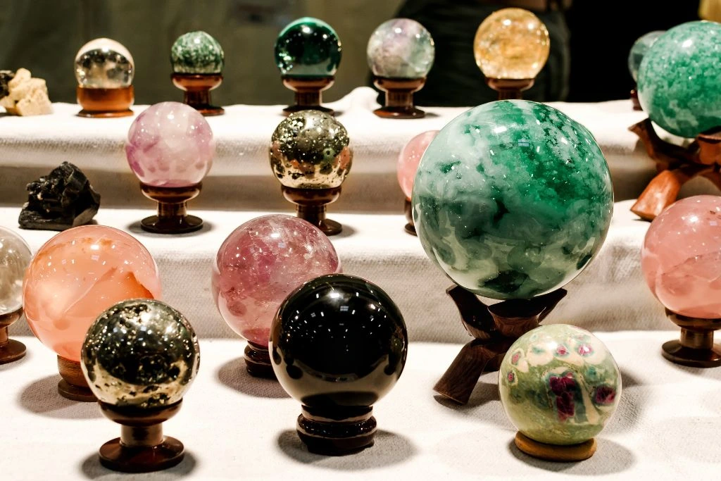 Different kinds of crystal spheres on pedestal