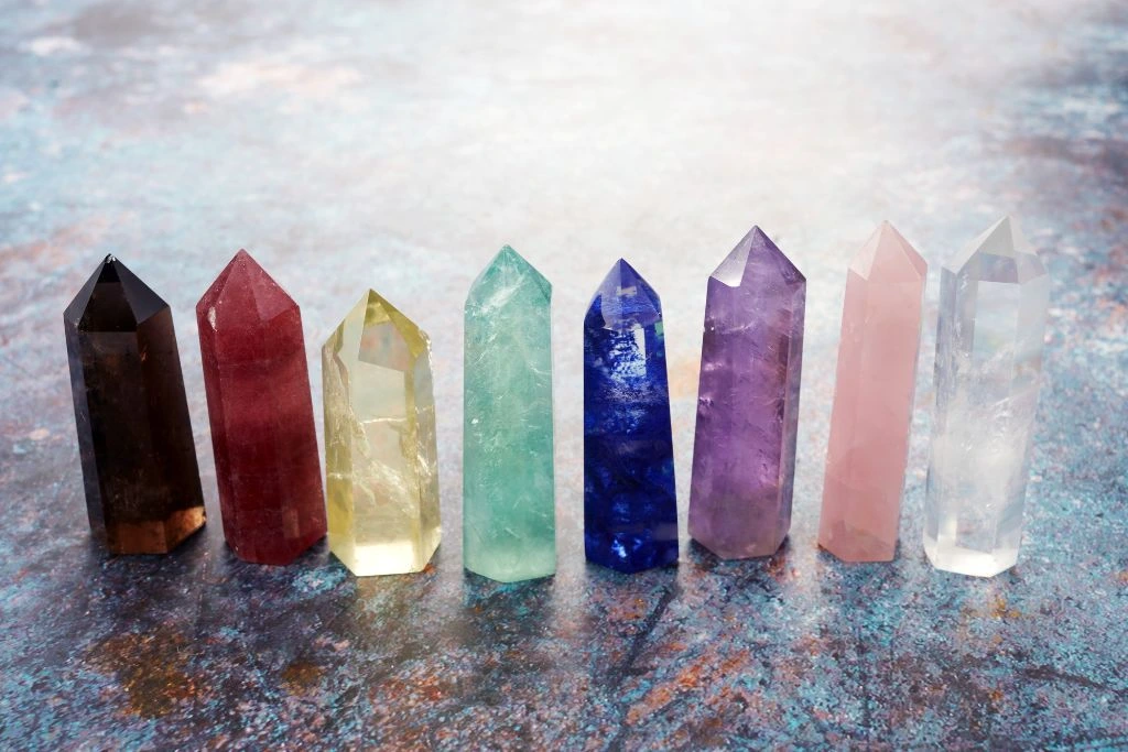 Different kinds of chakra wands on the floor