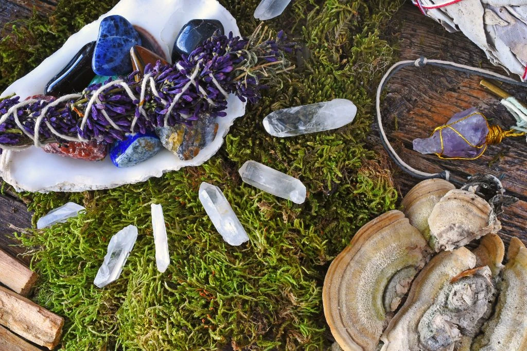 Different kinds of crystals and a smudge stick in nature