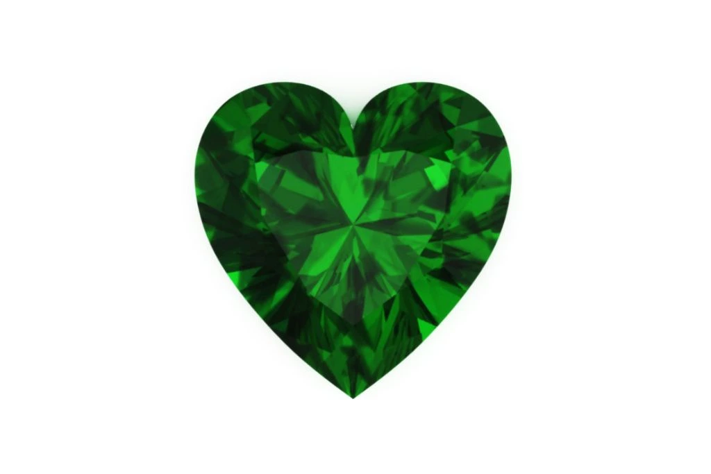 Heart shaped green topaz on white background