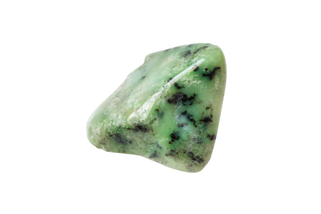 Green garnet crystal on white background