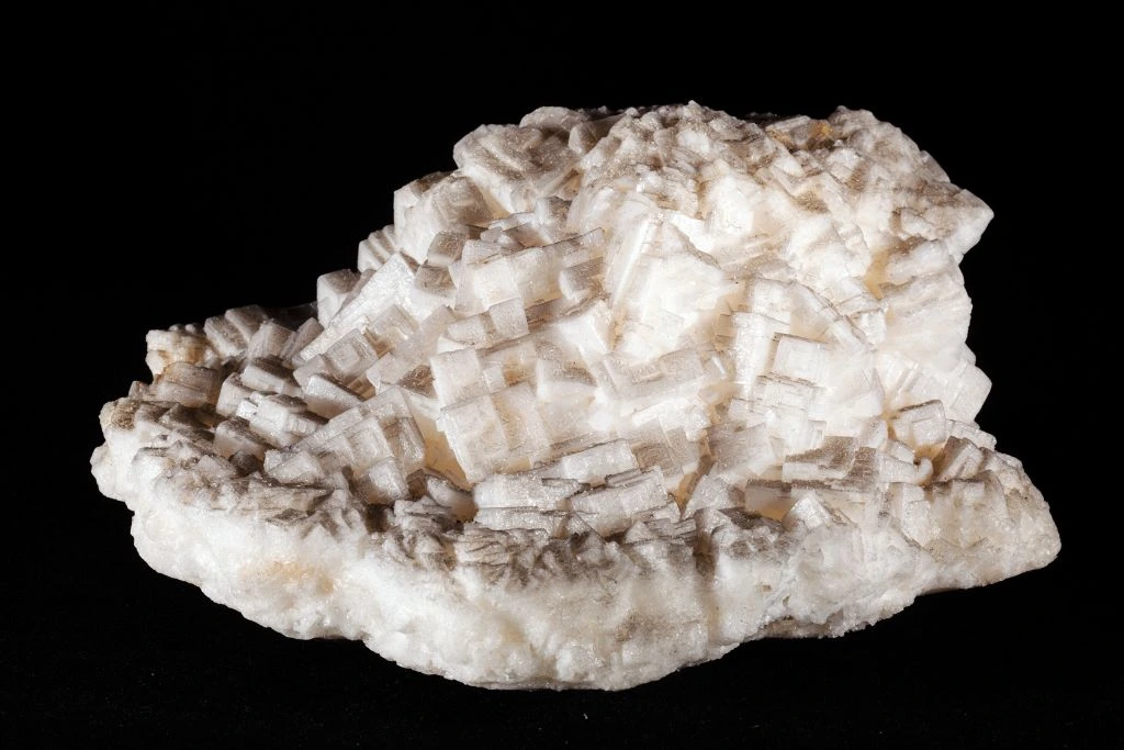 A halite crystal on a black background