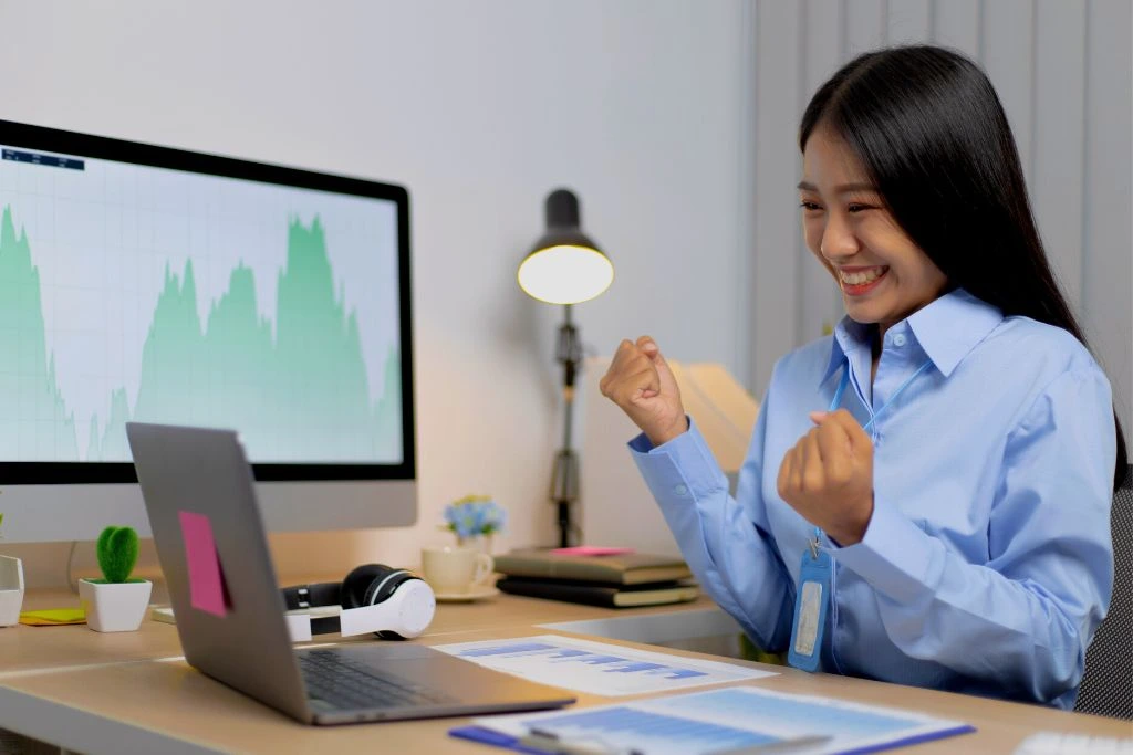 A happy positive woman at the table