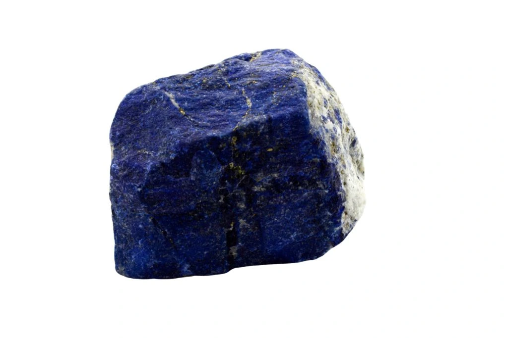 a raw lapis lazuli crystal on white background