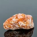 Orange calcite on a dark background