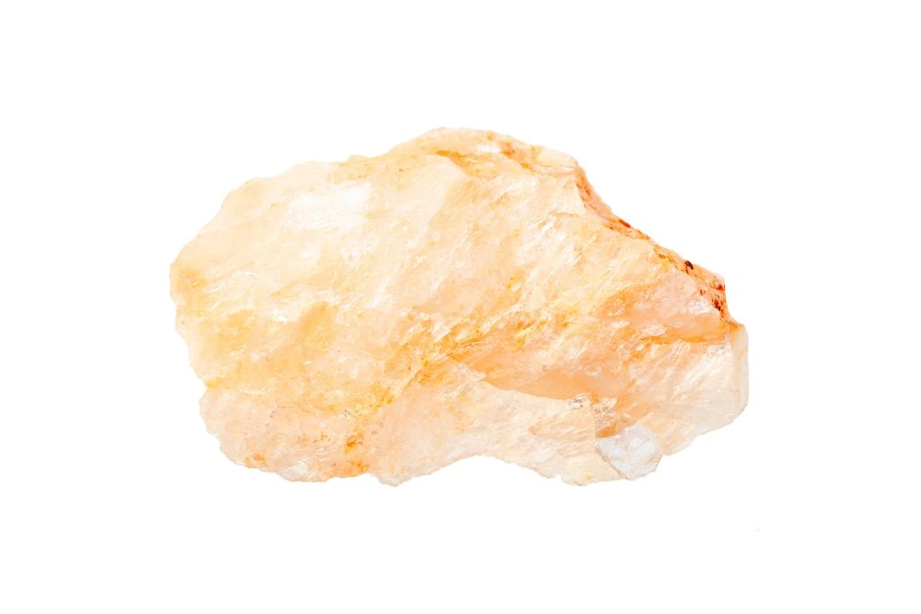 raw Orange moonstone on a white background
