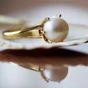 A pearl ring on a clam