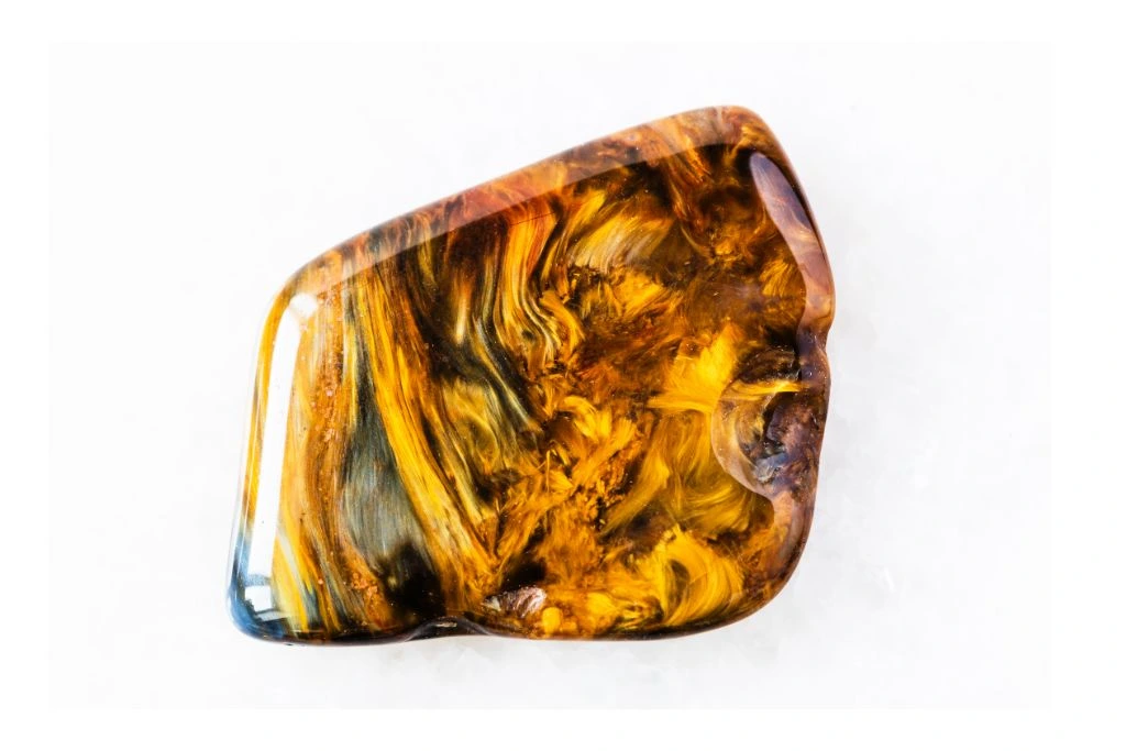 a pietersite crystal on a white background