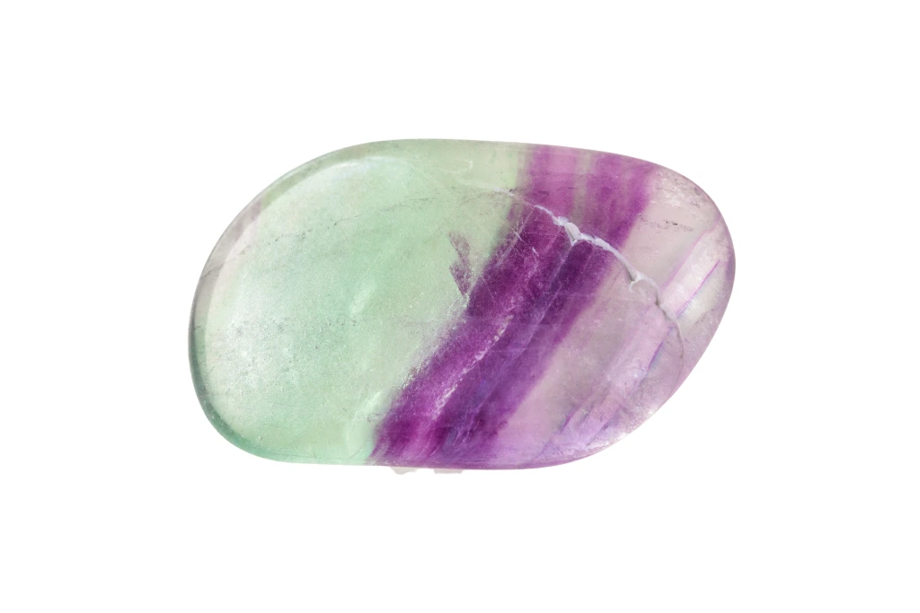 polished fluorite crystal on a white background