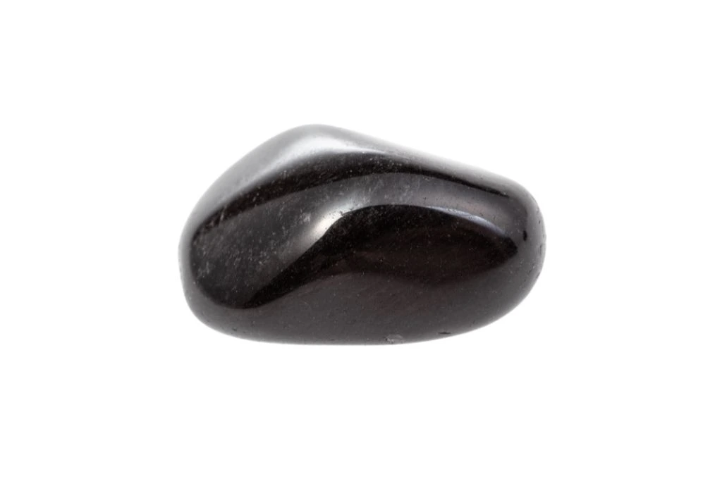 polished black obsidian on a white background