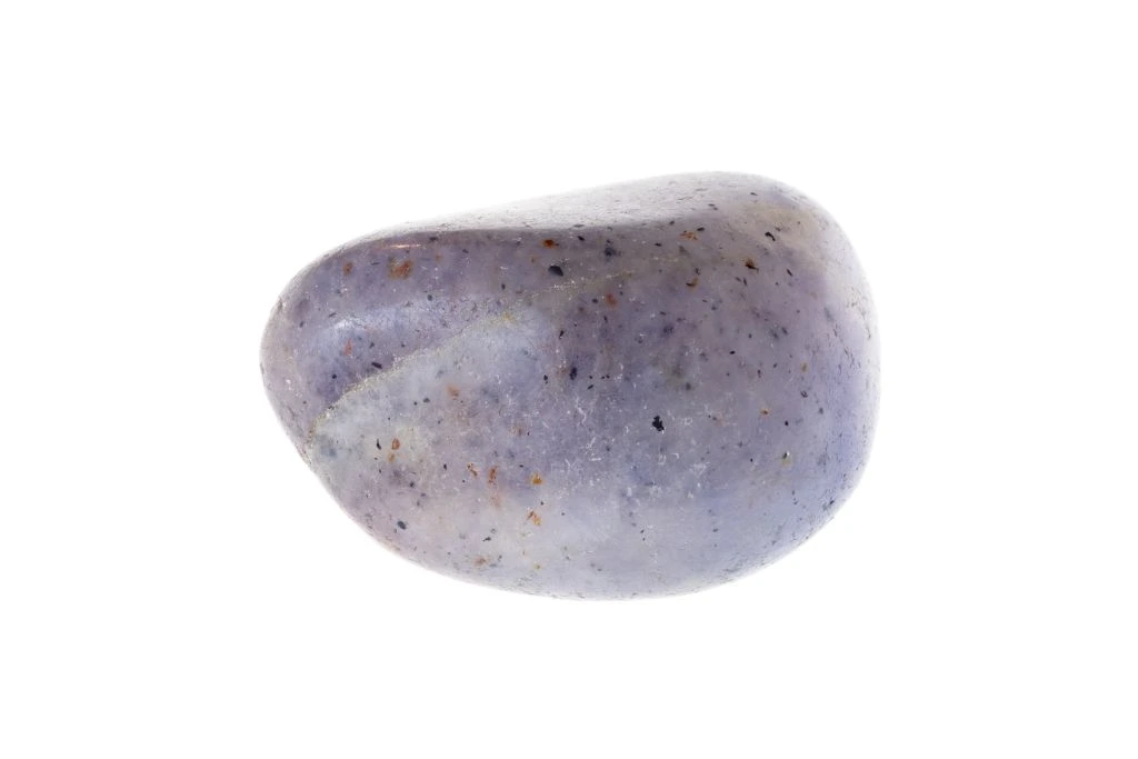 polished iolite crystal on a white background