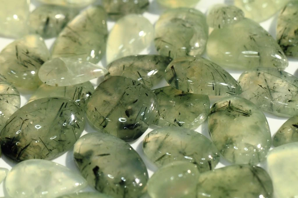 Different shapes of a polished Prehnite crystal