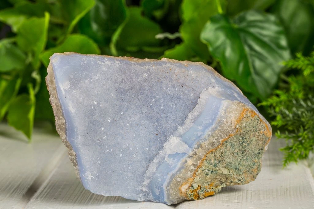 A raw blue lace agate on the table