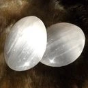 Polished Selenite crystal placed on a brown fur-cloth