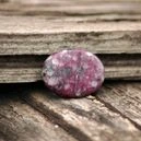 Sugilite crystal on the table