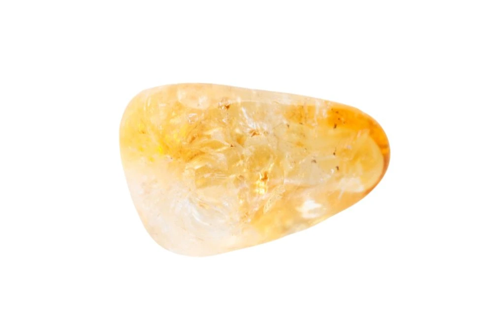 polished Citrine crystal on a white background
