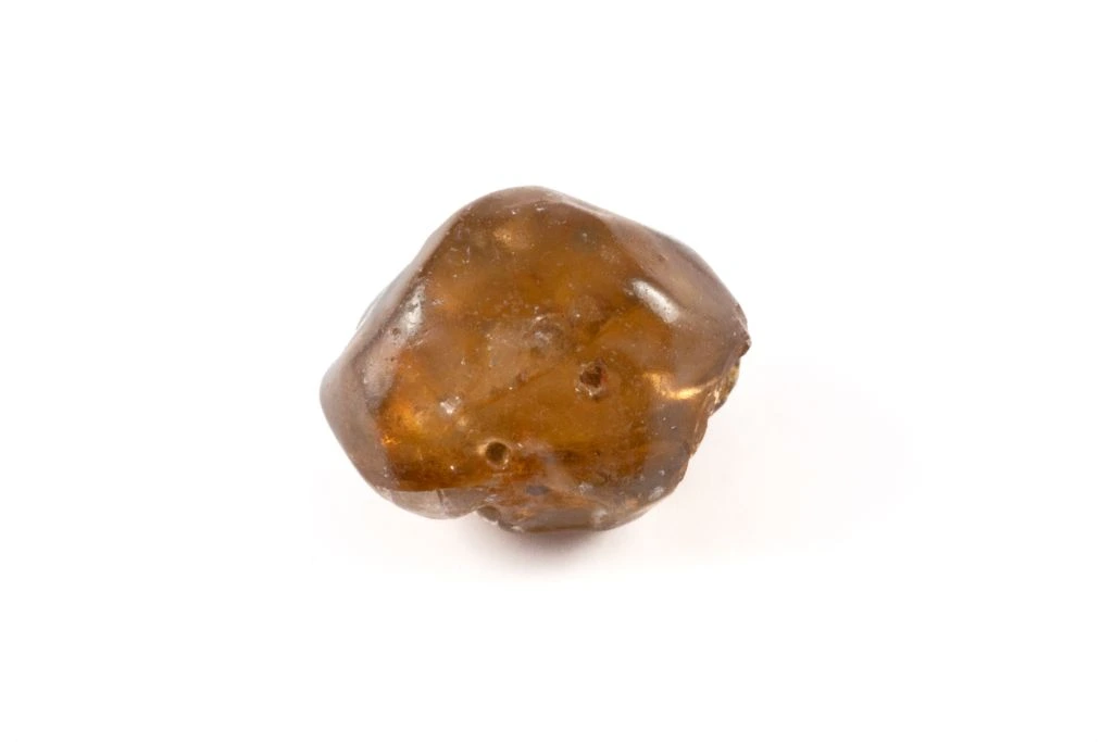 An orange zircon on a white background