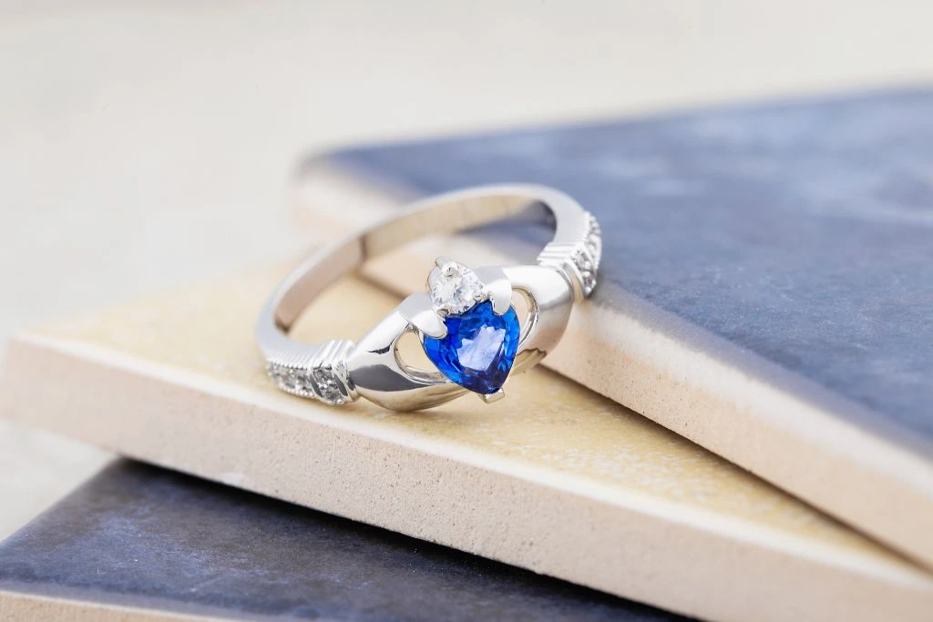 a ring with a blue topaz crystal