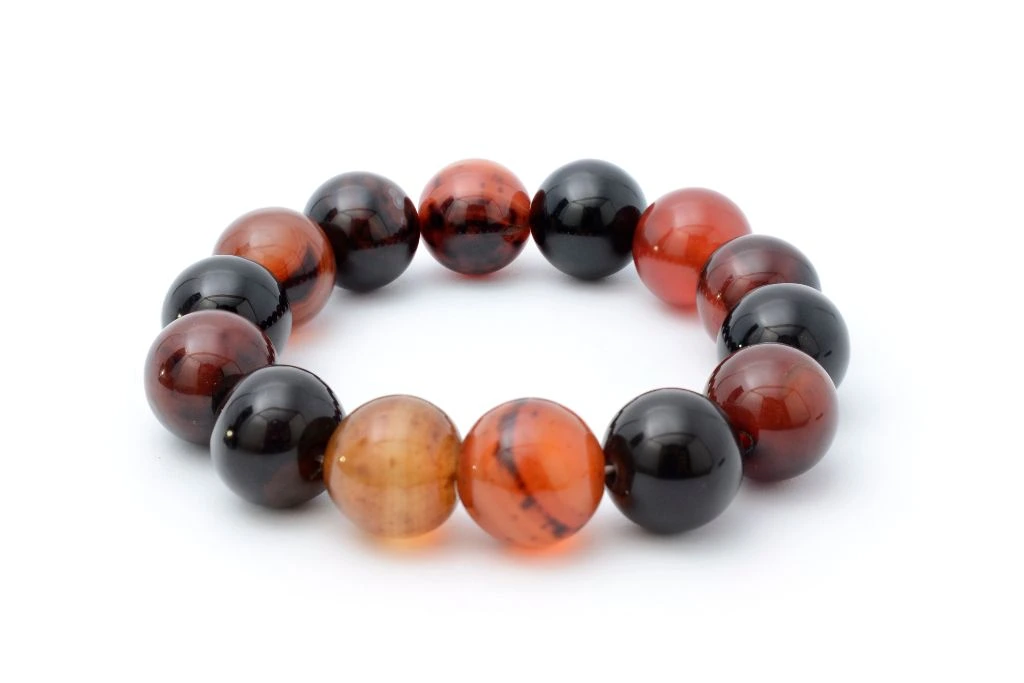 carnelian beaded bracelet on white background