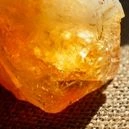 a citrine crystal on a jute mat