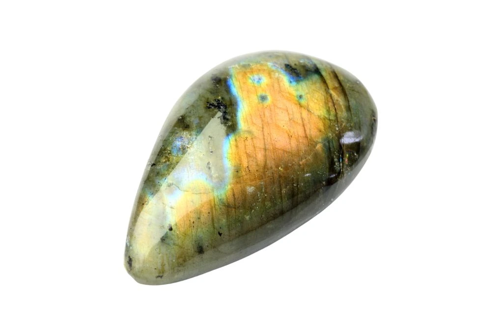 A labradorite crystal on a white background