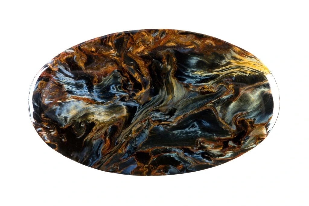 Polished green pietersite on white background