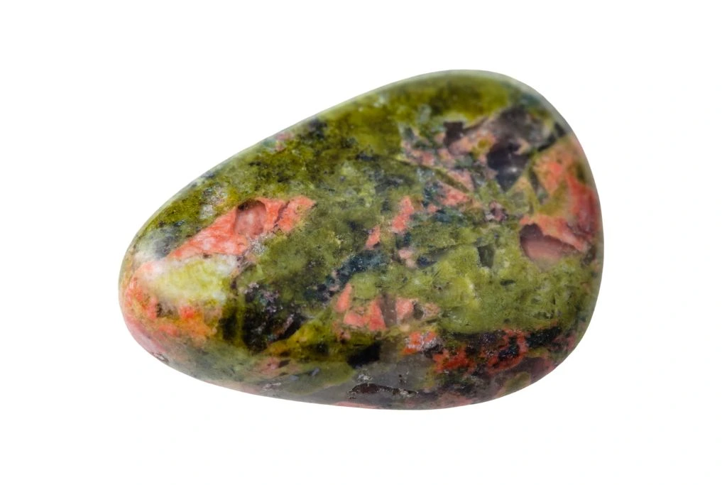 green unakite gemstone on white background