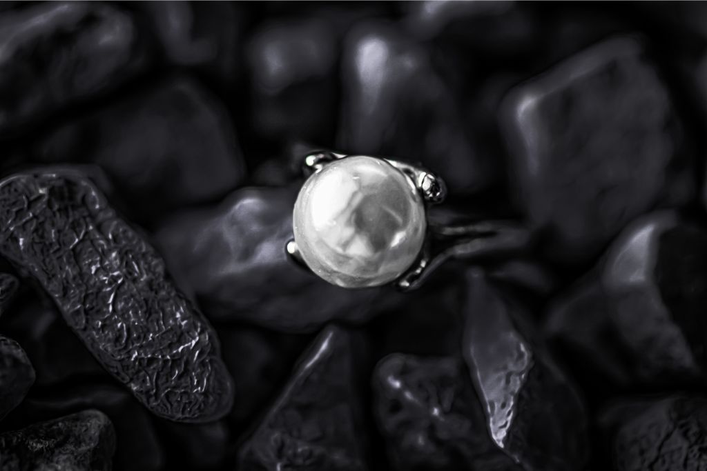 pearl ring together with polished gemstones