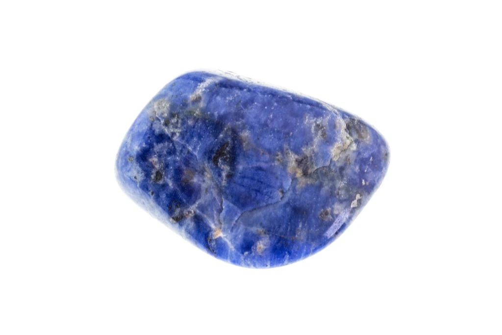 polished Sodalite crystal on a white background