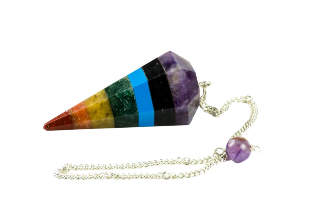 7 chakras pendulum on a white background