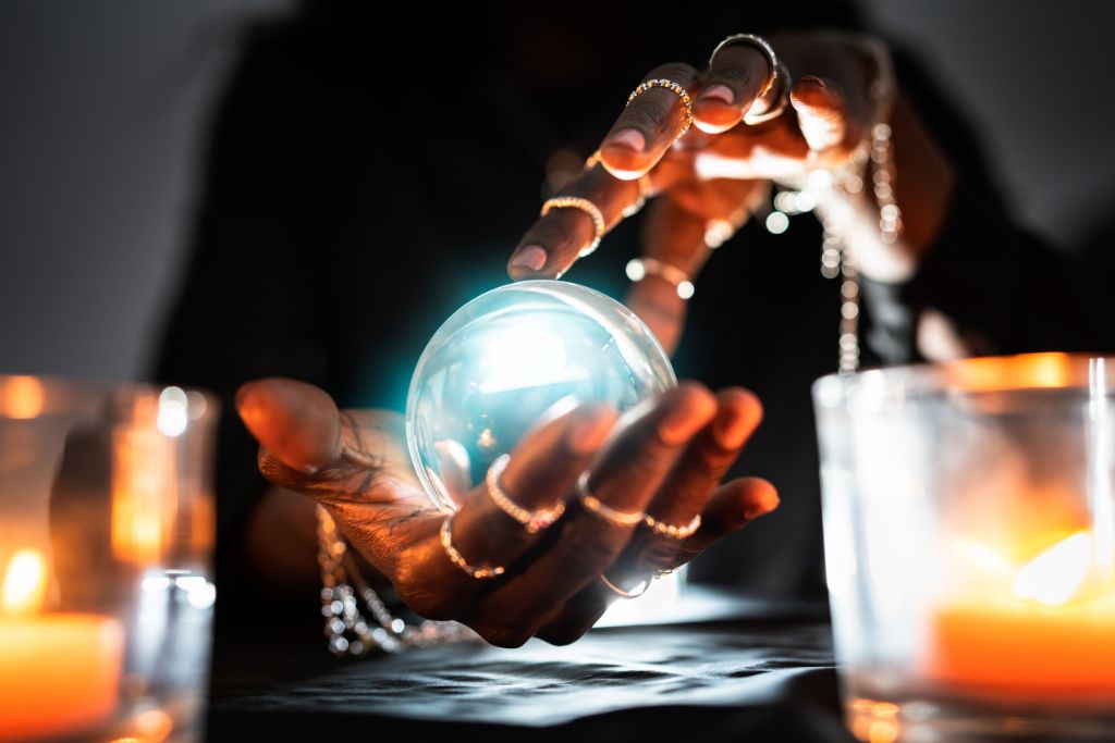 A person holding a crystal ball