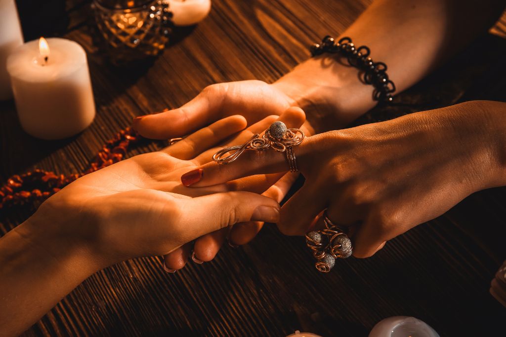 A psychic reading a person hands