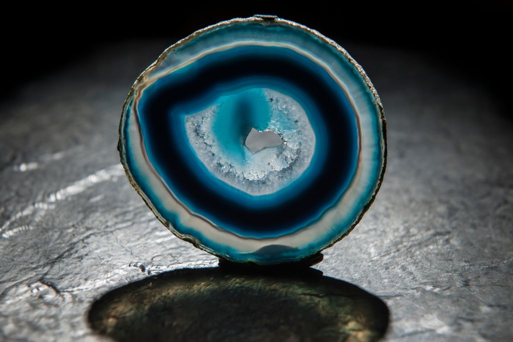 A slice of blue agate that is standing on its side