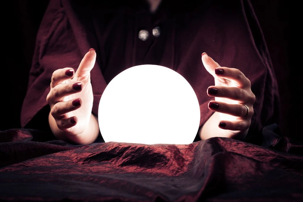 A woman hands over the sides of the crystal 