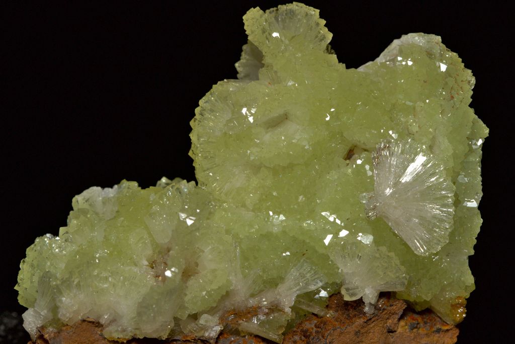 An adamite crystal on a black background