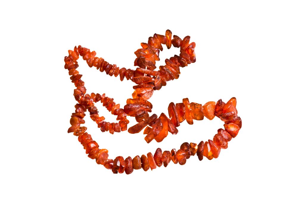 An amber necklace on a white background