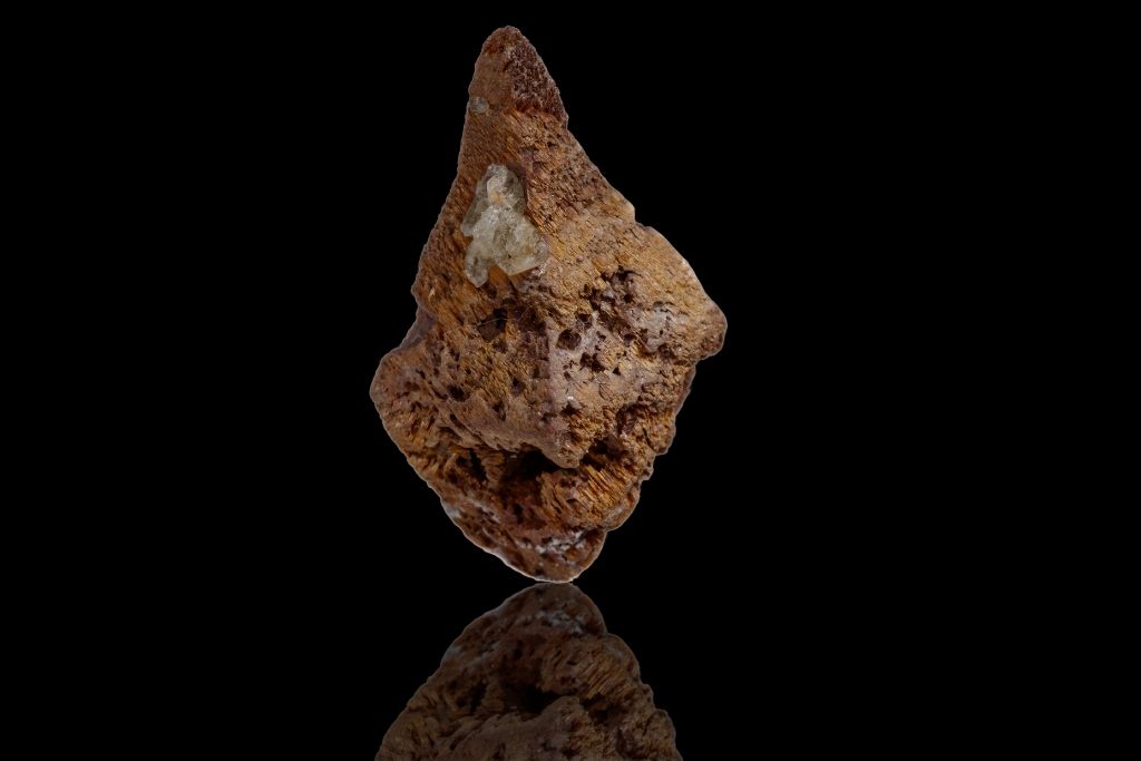 An Anatase crystal on a black reflective background