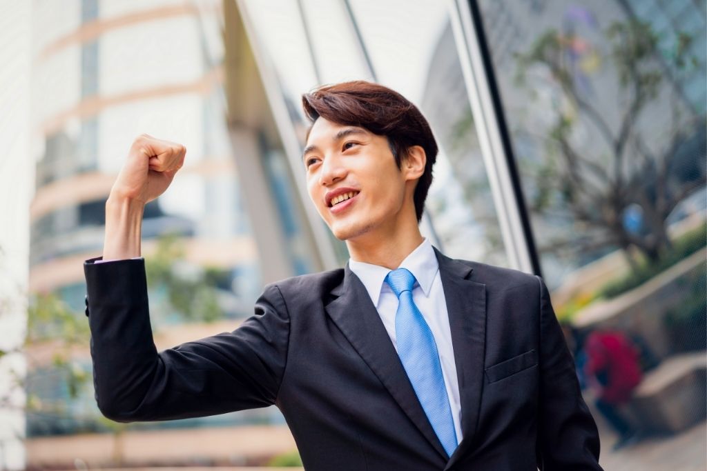 happy asian businessman and having positive affirmations