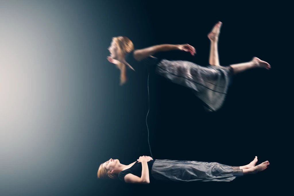The body of the woman is sleeping while her soul is floating and connected by a cord