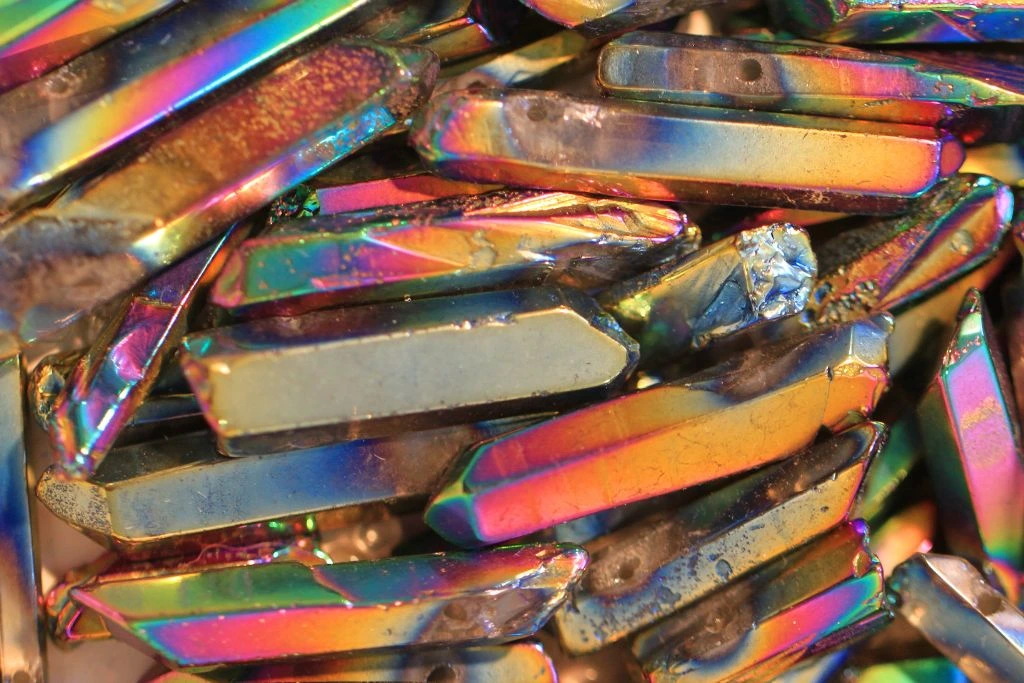 Different cuts of aura quartz crystal