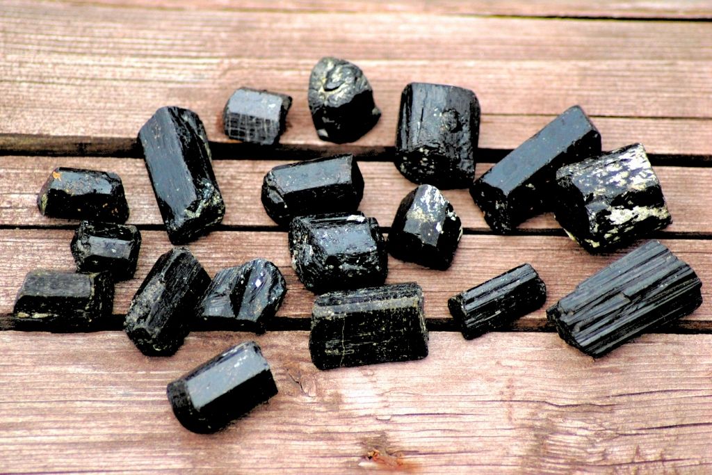 Black Tourmaline collection placed on a wooden platform