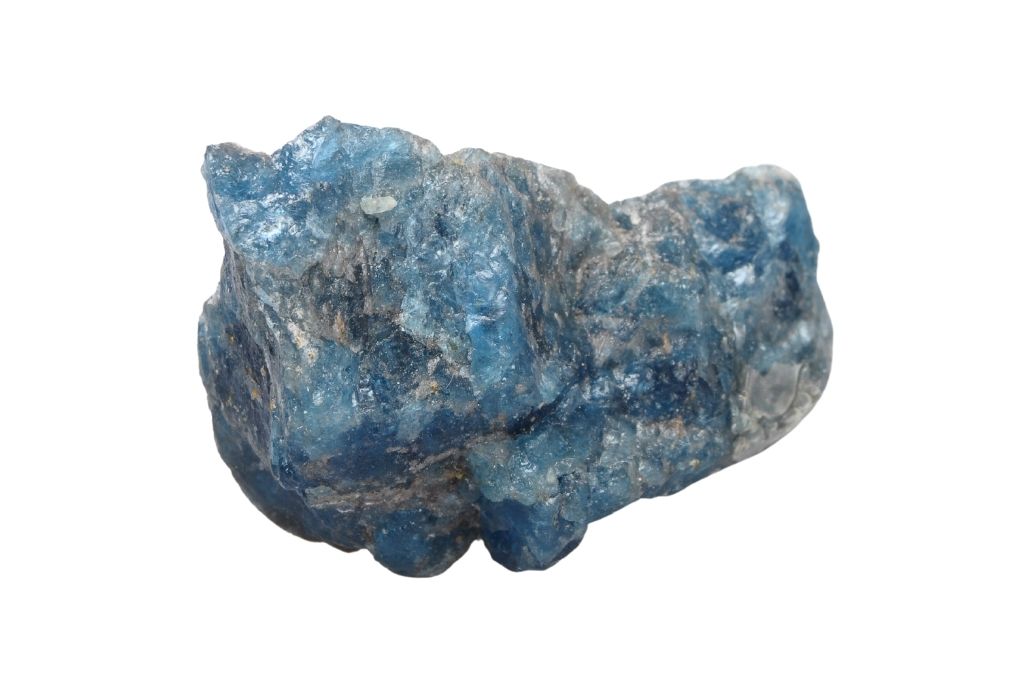 Blue apatite crystal on a white background