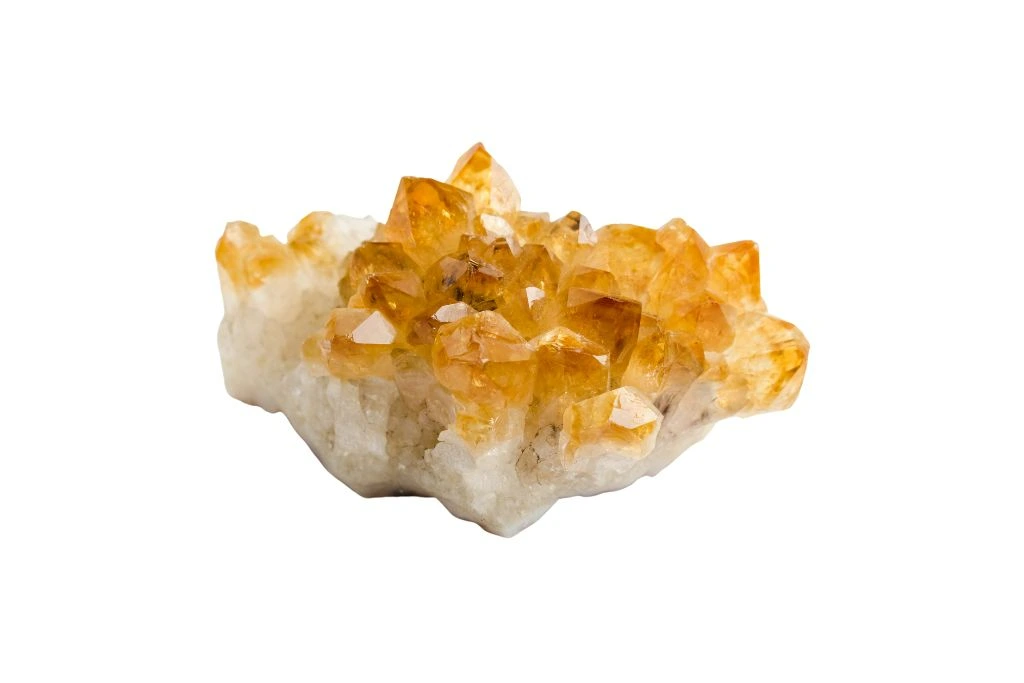 A cluster of citrine crystal on white background
